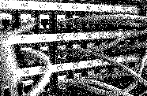 Dithered photograph of network cables plugged into a patch panel.